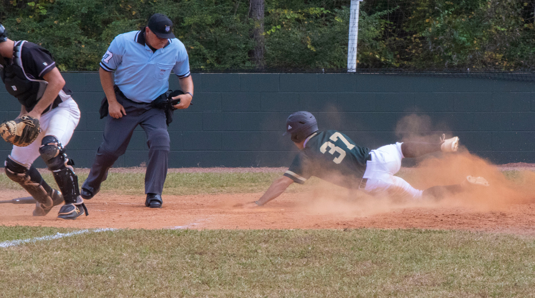 Bobcat baseball player slides into home