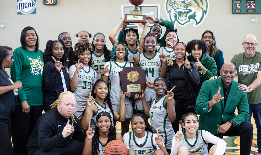 Lady Bobcat Basketball Team, coaches, support staff and EGSC President celebrate win